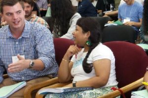 Two participants discuss CommB teacher training.